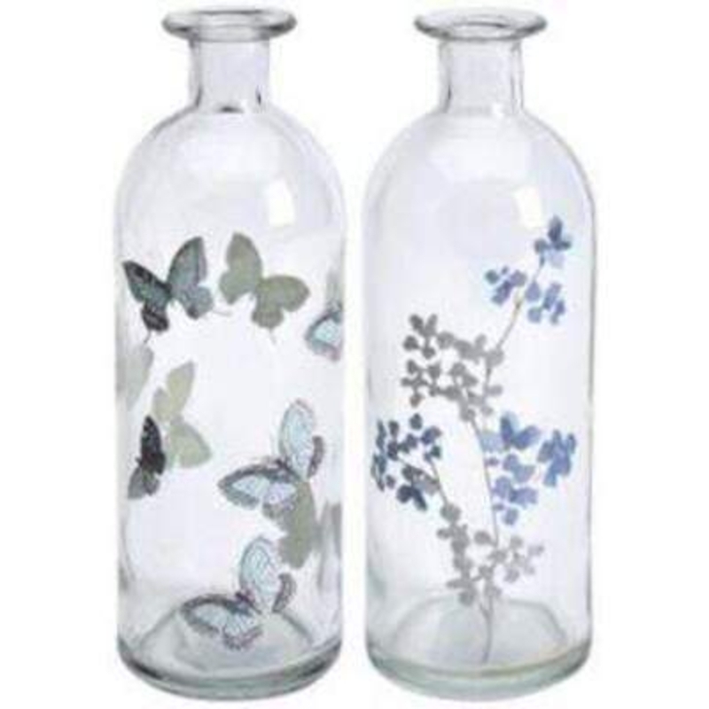 Choice of Butterfly or Flower Design Isabella Glass Bottle Vase by Transomnia. Delicate bottle shaped vase to hold flowers. A lovely glass vase that would look good in use or not. One bottle vase has a grey butterfly design on and the other has blue and grey flowers on. If a preference, please state Butterfly or Flowers when ordering. Size:  20 x 7 x 7cm